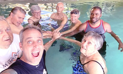 seniors in a water exercise class