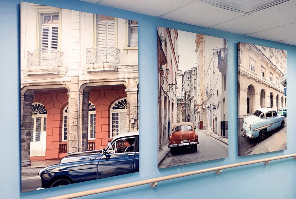 photos of old cars parked along a European street