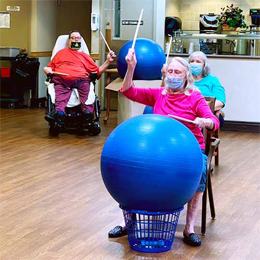 Engage in interactive drumming and invigorating exercise with yoga balls in our long term care community at Glencroft.