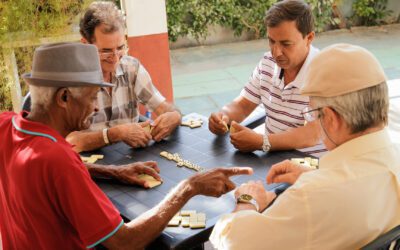 Active Retirement Happy Old Friends Playing Domino Game