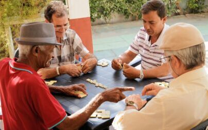 Active Retirement Happy Old Friends Playing Domino Game