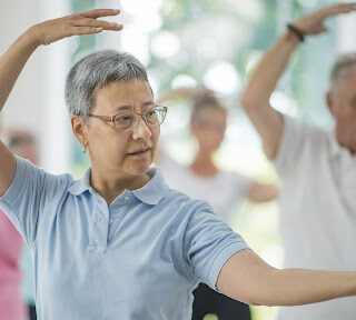 woman enjoying one of the many hobbies for seniors, tai chi