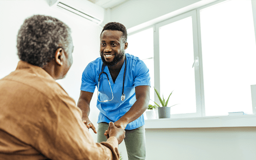 older man getting help with activities of daily living which is a service available in both memory care and assisted living