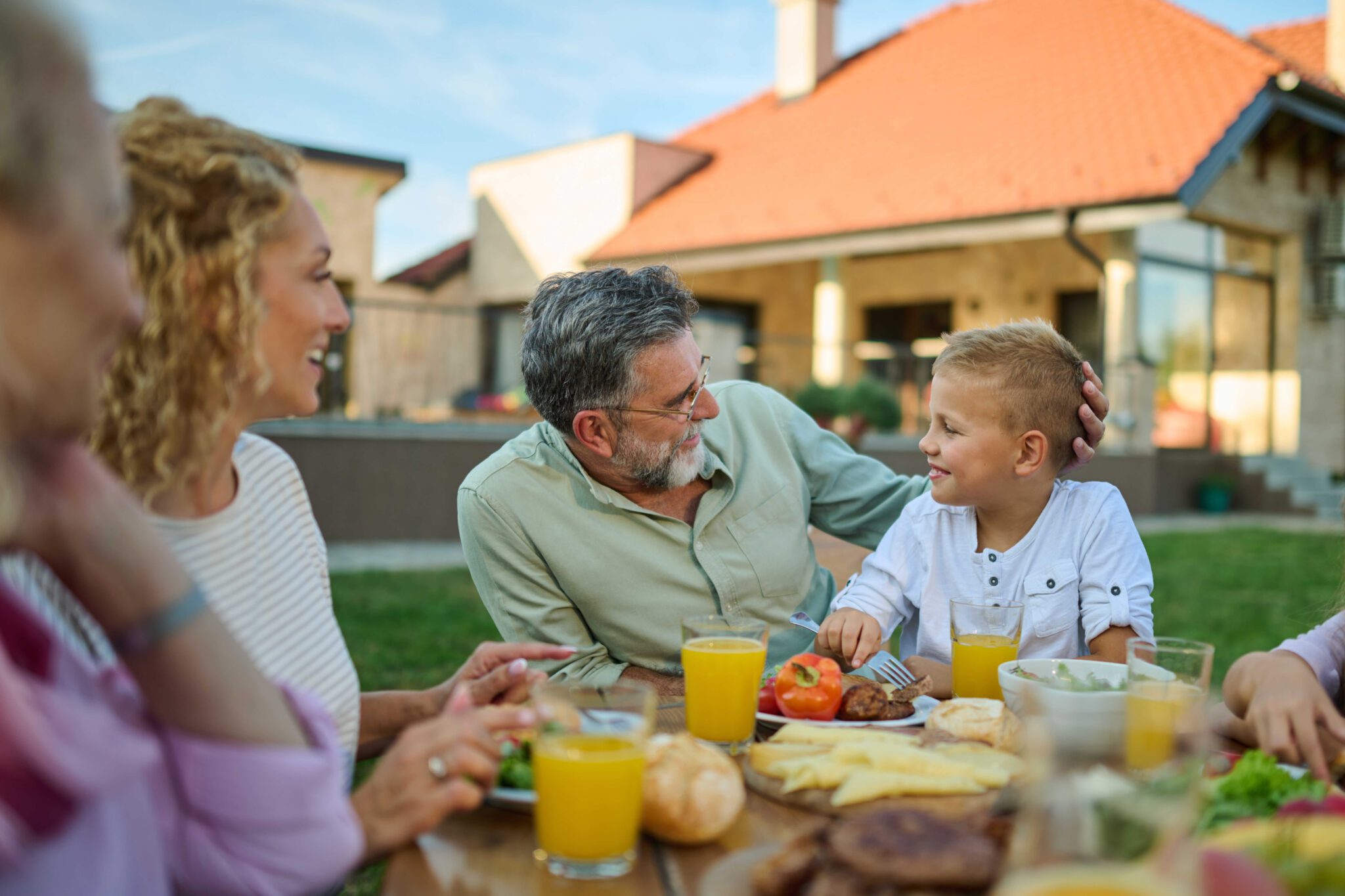 older adult with family outside
