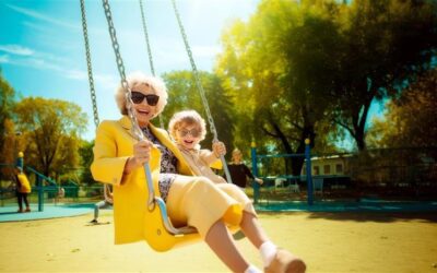 grandma and son swinging outside at a park in arizona winter weather