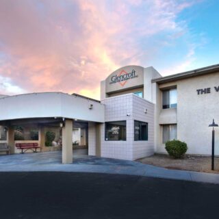 Exterior entrance of Glencroft Villas senior living community in Glendale, Arizona at sunset