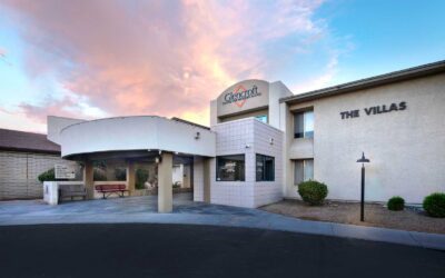 Exterior entrance of Glencroft Villas senior living community in Glendale, Arizona at sunset