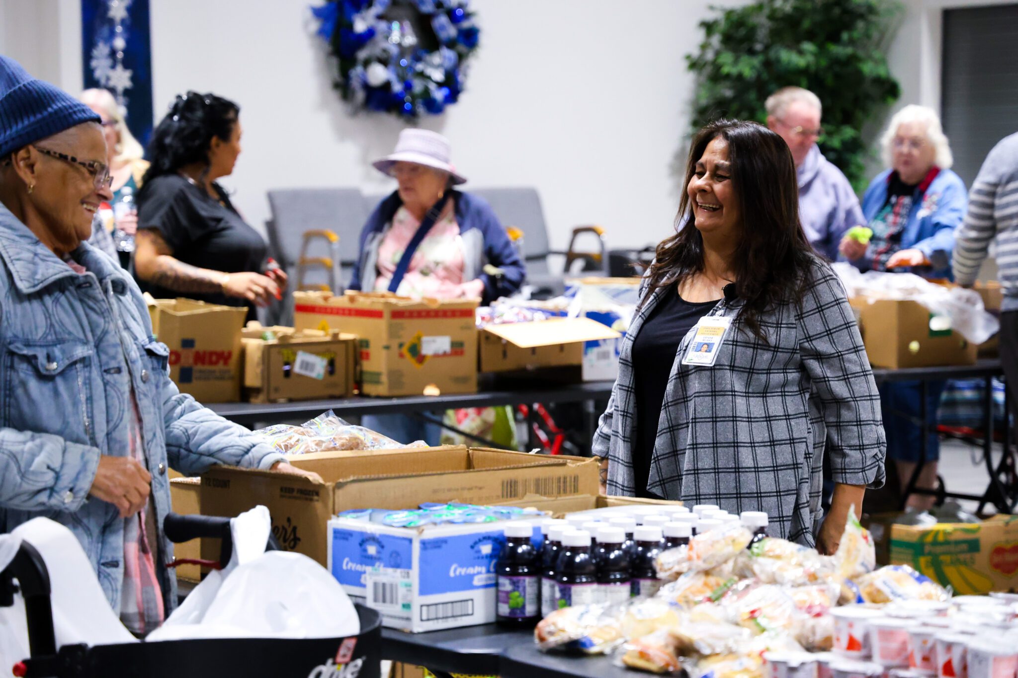 senior residents connecting at farmers market food bank Senior Living residents connecting at glencroft farmers market