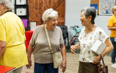 Two women laughing together at Glencroft Game Show Week